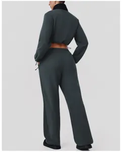 Back detail of dark grey fleece tracksuit set, featuring crop jacket and wide leg pants.