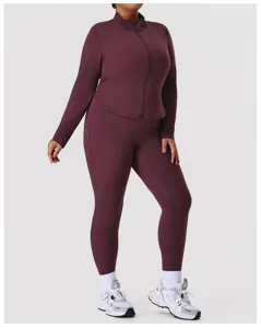 Plus size activewear set in dark red, featuring a zip-up jacket and high-waisted leggings.