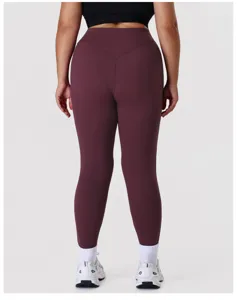 Detailed view of high waist yoga leggings in dark maroon, showing rear contour seam fit.
