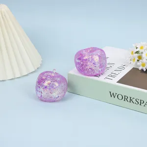 Purple glitter slow rebound apple stress relief toy detail view for fun sensory play.