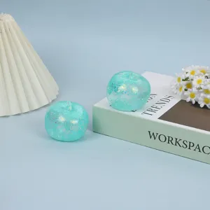 Close-up of glitter blue apple stress relief toy, slow rebound squishy sensory toy detail.