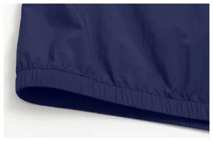 Detailed close-up shot of men's outdoor sports jacket navy blue ripstop fabric elastic hem.