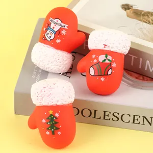 Dettagli giocattolo antistress guanto Natale, bambola morbida plastica rossa con polsino soffice.
