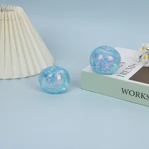 Glitter apple stress relief ball detail view, slow rebound sensory fidget toy for anxiety.