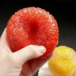 Balle anti-stress smoothie aux fruits texture sable jouet sensoriel pour se détendre.