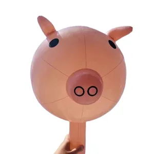 Inflatable cute pink pig head balloon toy, PVC material with handheld stick for kids.