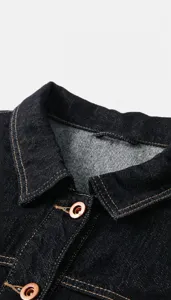Dark denim vest collar detail, vintage casual sleeveless jacket with classic lapel design.