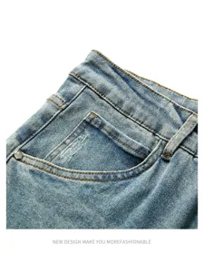 Men's denim jeans detail close-up showing pocket craftsmanship and vintage washed texture.