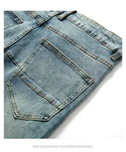 Men's vintage washed denim jeans back pocket detail, close-up texture shot, slim fit.