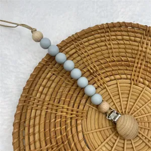 Silicone wooden baby pacifier clip teething toy soothing anti drop chain for infants.