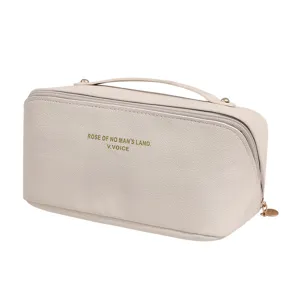 Beige leather cosmetic bag travel toiletry pouch with handle and zipper closure for women.