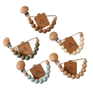 Silicone beech wood baby pacifier clip teething chain set, safe soothing chew toy for infants.