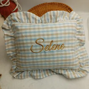 Nordic ramie throw pillow with ruffled edge, custom gold embroidered Selene name, cozy baby cushion.