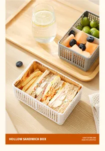 Detailansicht der tragbaren faltbaren Sandwichbox mit ordentlicher Speisenpräsentation.