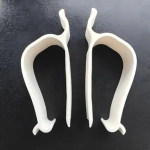 White plastic toilet seat fixing clips and lifters, durable and practical bathroom accessories set.