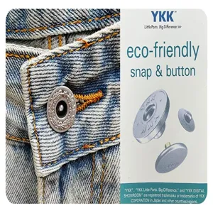 Detailed view of blue washed denim fabric featuring durable metal snap button and YKK hardware.