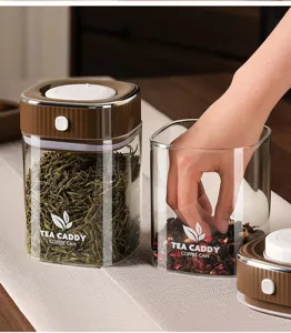 Airtight vacuum glass tea coffee storage canister, transparent food container with press lid for home.