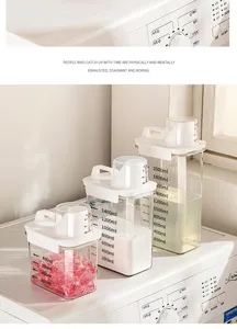 Transparent plastic laundry storage jar detail, clear scale lines and measuring cup lid.