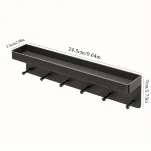 Gedetailleerd overzicht van de zwarte wandplank met opbergvak en handige multifunctionele haken.