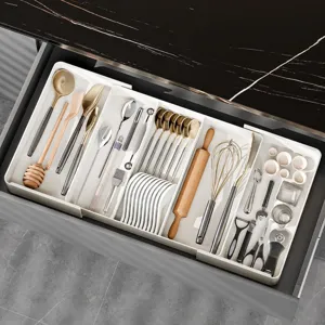 Expandable kitchen drawer organizer for cutlery, silverware and utensils storage tray.