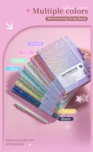 Close-up of A5 glitter hardcover notebooks in multiple vibrant colors with a pen.
