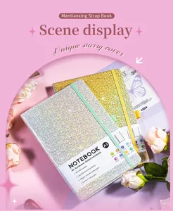 Detailed view of A5 starry glitter hardcover notebook with elastic strap and pen loop
