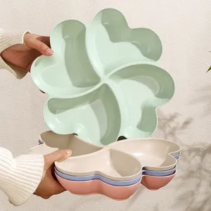 Heart-shaped 4-compartment clover fruit plate snack storage tray for living room use.