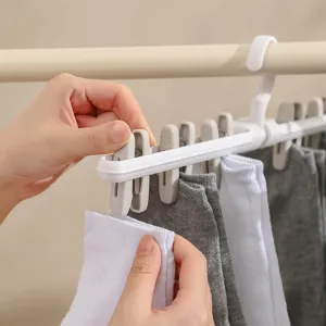 Draagbare kunststof multi-clip kledinghanger opvouwbare sokkendroogrek voor thuisgebruik.