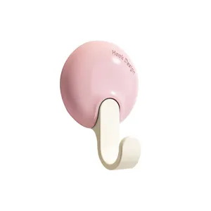 Dopamine style adhesive wall hook for kitchen and bathroom, punch-free key storage holder.