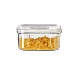 Clear plastic square food storage container with airtight white lid and spoon for kitchen pantry.