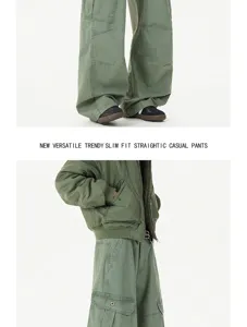 Green cargo pants detail shot, loose fit straight casual streetwear style with multiple pockets.