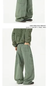 Green loose fit cargo pants for men and women, casual streetwear with multiple pockets.
