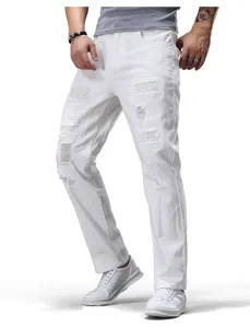 Detail view of men's white ripped denim jeans featuring stylish distressed patch elements.