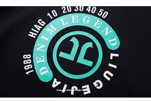 Close-up detail of the trendy plus-size letter printed hoodie in black fabric style.