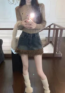 Falda corta de denim para mujer con dobladillo mullido estilo callejero ajuste delgado linea a verano