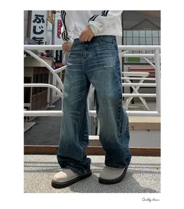 Mens retro washed loose straight leg denim jeans with trendy wide leg drape fit pants.