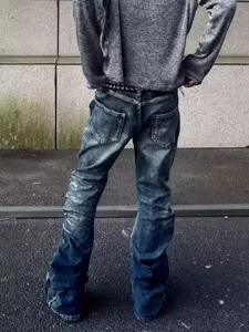 Men's retro distressed stacked flare jeans with vintage wash, gothic street style denim pants.