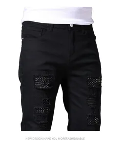 Men black ripped denim jeans detail featuring rhinestone mesh patchwork and slim straight fit.