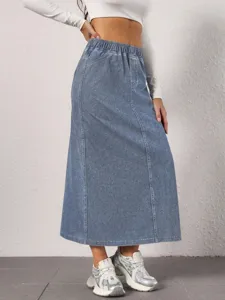 Detail view of women's blue denim midi skirt featuring high waist and elastic waistband.