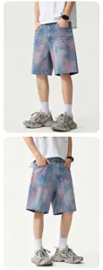 Detailed view of blue tie-dye loose denim shorts, casual five-quarter summer pants for men.