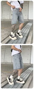Men's stylish washed denim shorts casual streetwear fashion five-point pants vintage design.