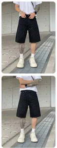 Men high street washed black denim shorts with allover cross jacquard pattern, casual streetwear.