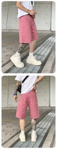 Men's washed pink denim shorts street style casual summer streetwear fashion apparel design.