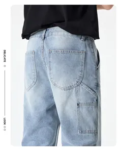 Detailed back view of men's loose light blue denim cargo jeans with carpenter pockets.