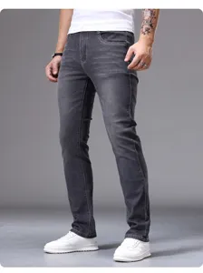 Men's slim fit dark grey denim jeans detail shot, casual wear and fabric texture.