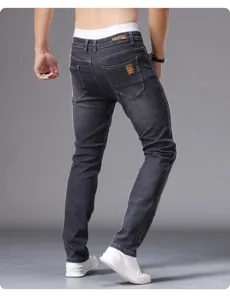 Men slim fit skinny jeans in dark grey wash, detailed back view showing casual denim style.