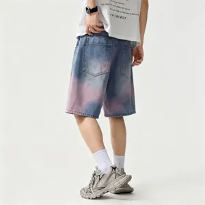 Men's loose fit denim shorts with trendy tie-dye design, casual five-point jeans for summer.