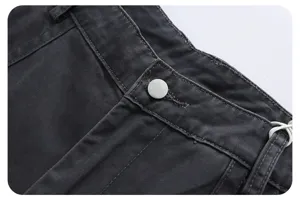 Detail shot of dark grey washed cargo pants waistband featuring metal snap button and clean twill fabric.