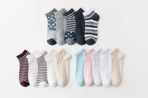 Cotton women short boat socks flat lay display showcasing various colors and basic patterns.