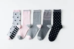 Detailed view of women's mid-calf cotton socks in assortment of stripes, dots and solid colors.